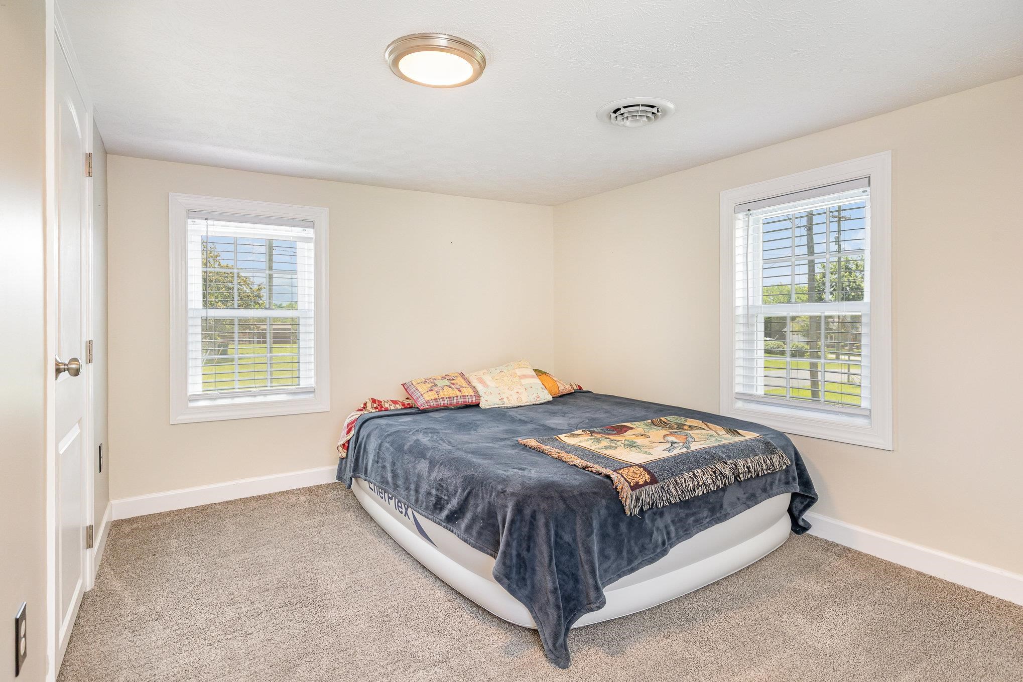 406 6th Street Luray, VA 22835 - Photo 18 of 28 a bedroom with a bed and window