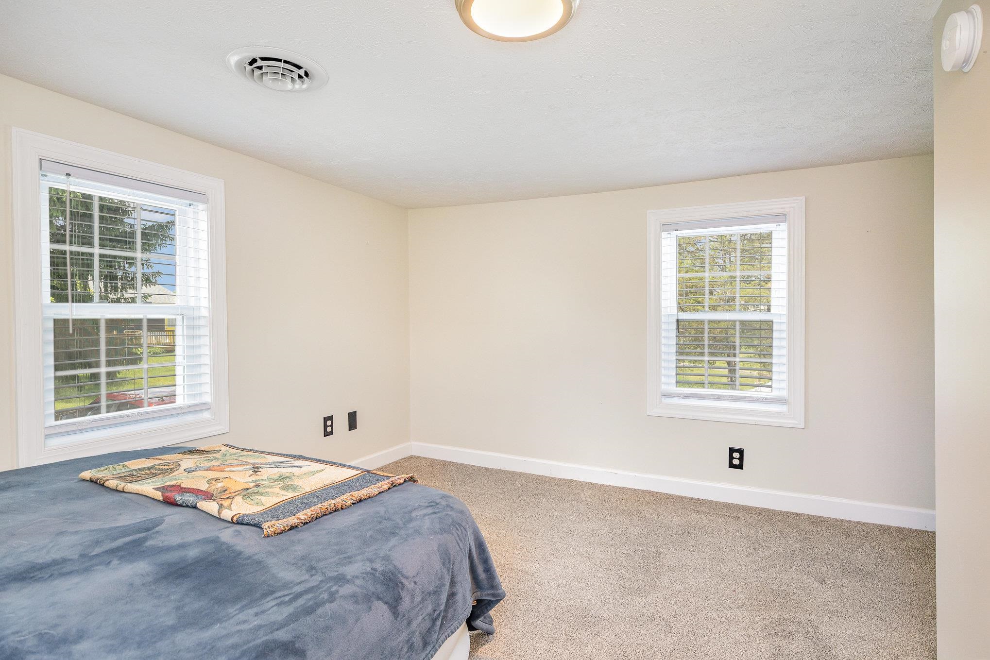 406 6th Street Luray, VA 22835 - Photo 19 of 28 a bedroom with a bed and a window