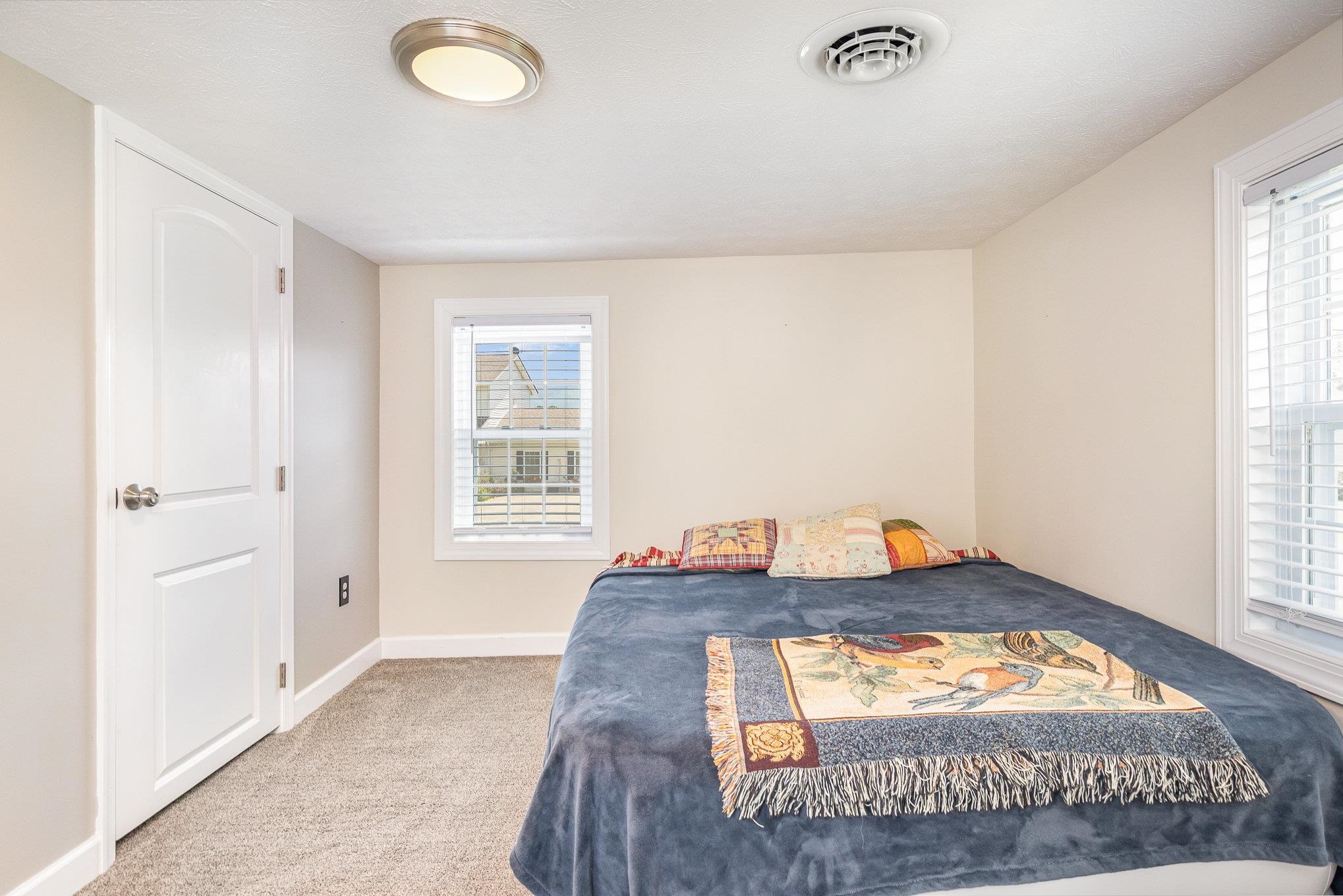 406 6th Street Luray, VA 22835 - Photo 20 of 28 a bedroom with a bed and a window