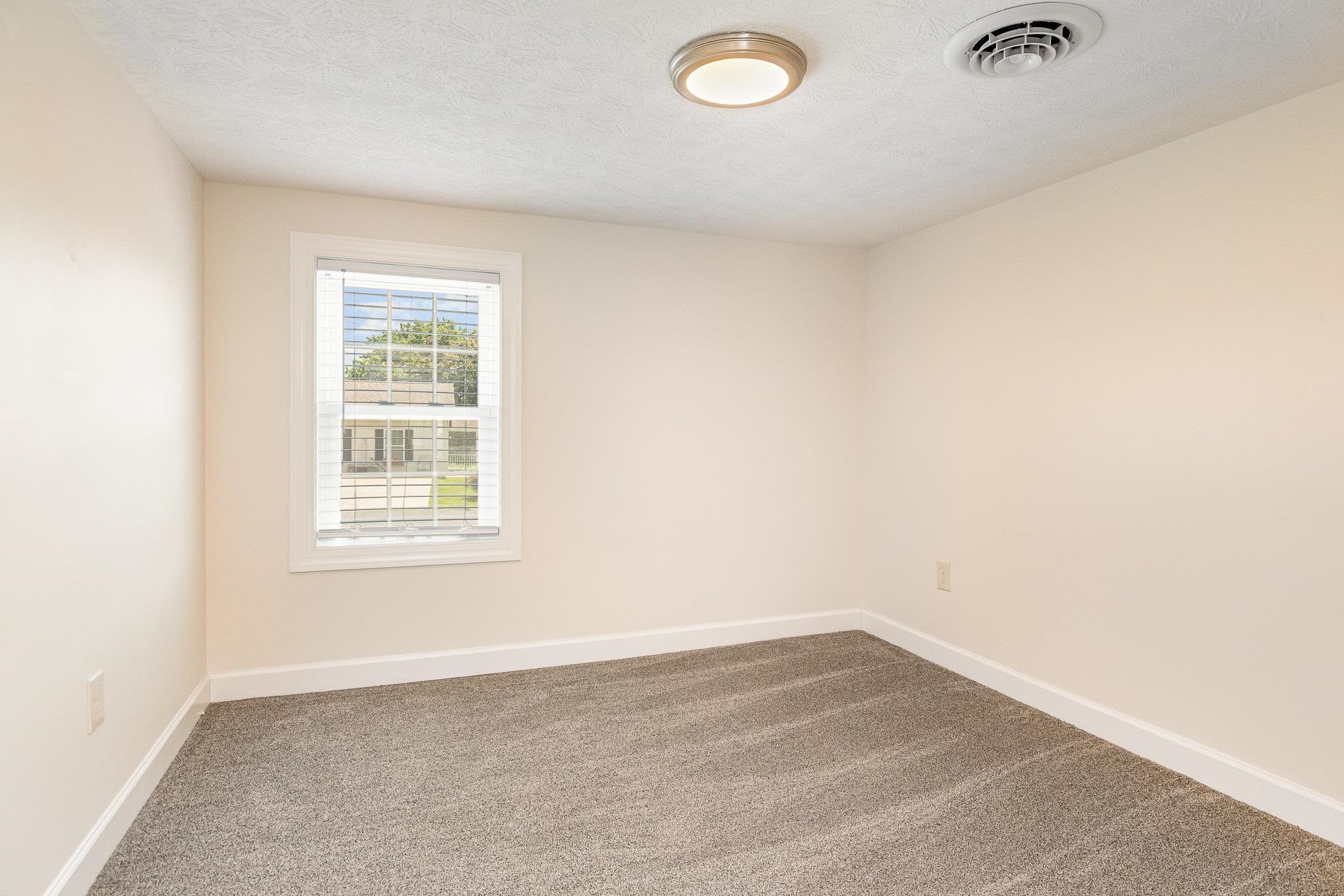 406 6th Street Luray, VA 22835 - Photo 21 of 28 an empty room with a window
