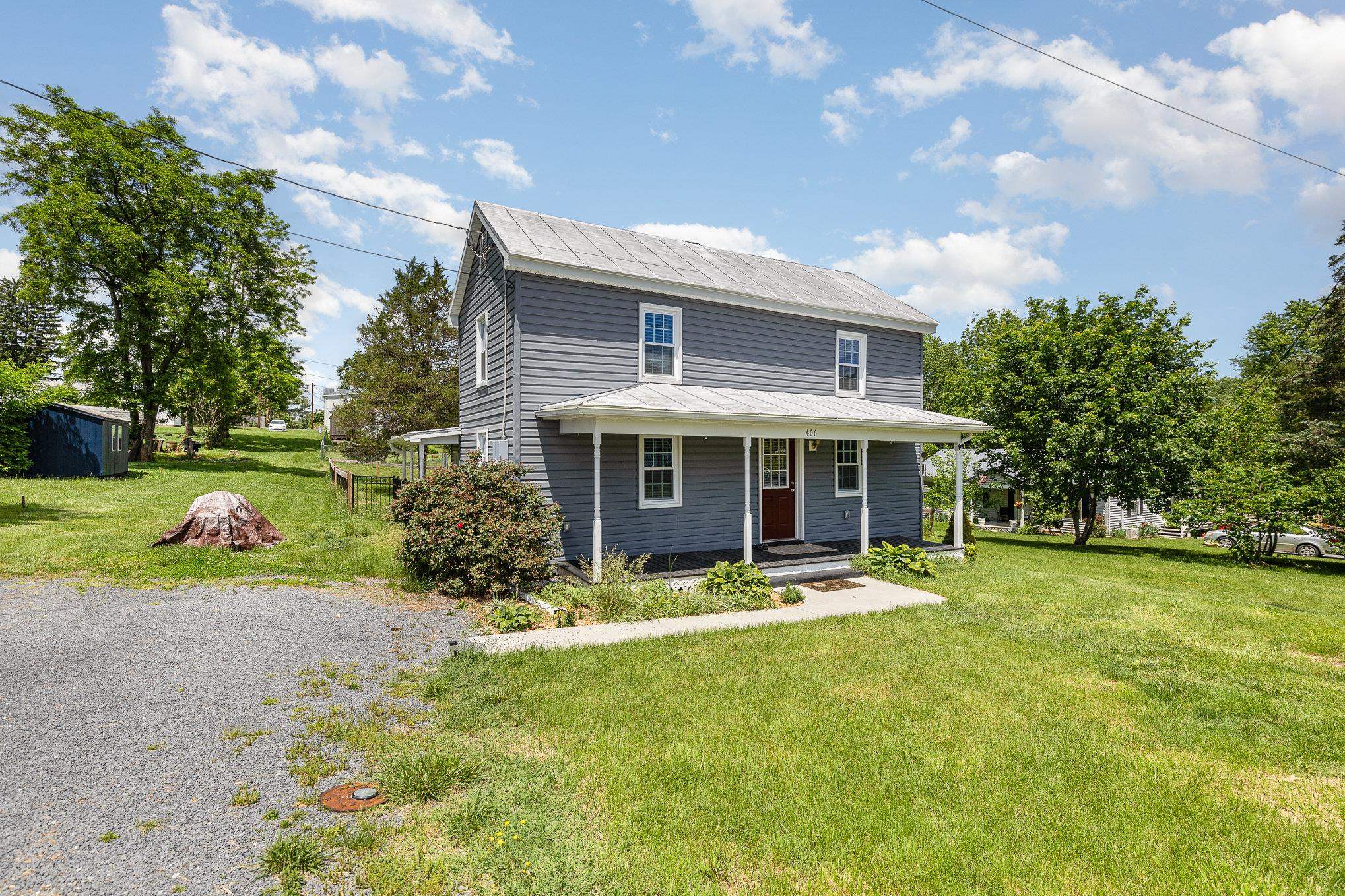 406 6th Street Luray, VA 22835 - Photo 4 of 28 a front view of house with yard and green space