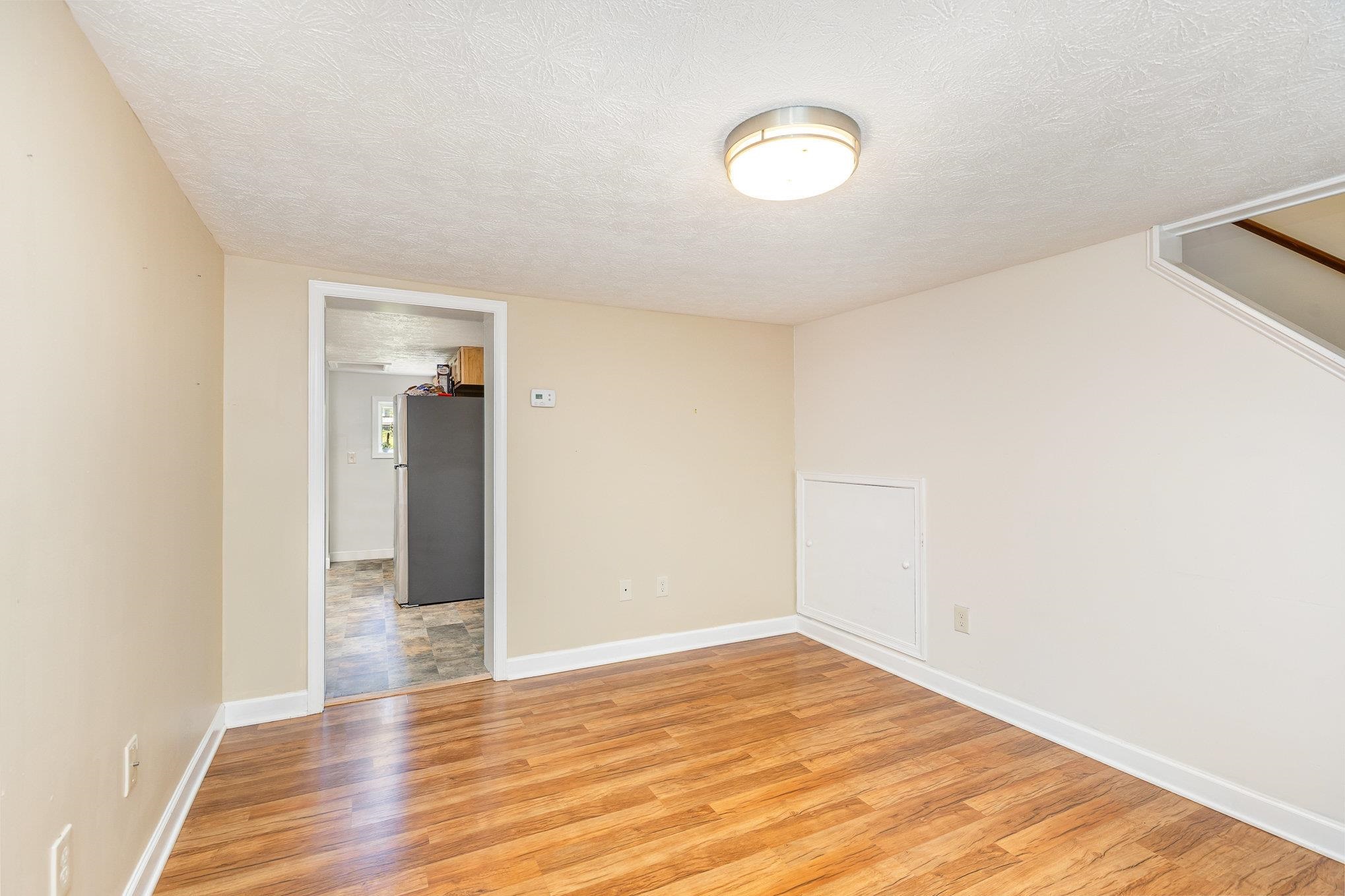 406 6th Street Luray, VA 22835 - Photo 5 of 28 a view of empty room with wooden floor