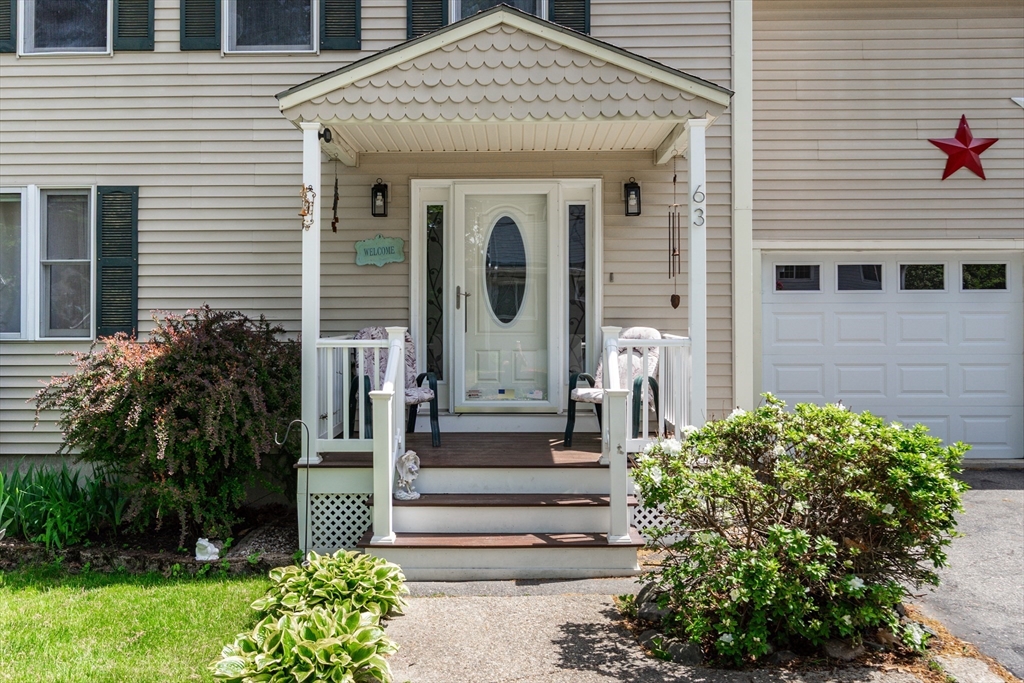 63 Bow Street Saugus, MA 01906 - Photo 2 of 42 a front view of a house with garden