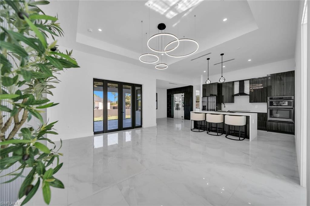 a view of kitchen with furniture and a potted plant