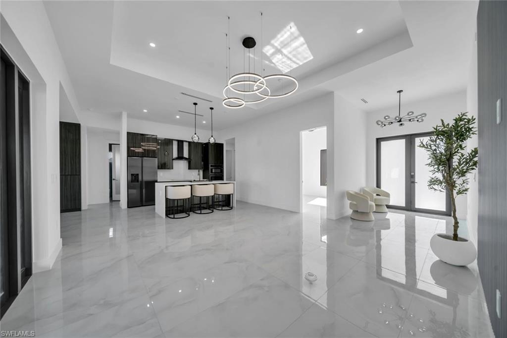 3312 17th Street Southwest Lehigh Acres, FL 33976 - Photo 2 of 12 a living room with furniture and a large window