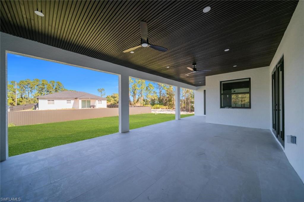 3312 17th Street Southwest Lehigh Acres, FL 33976 - Photo 6 of 12 a view of a porch and garden