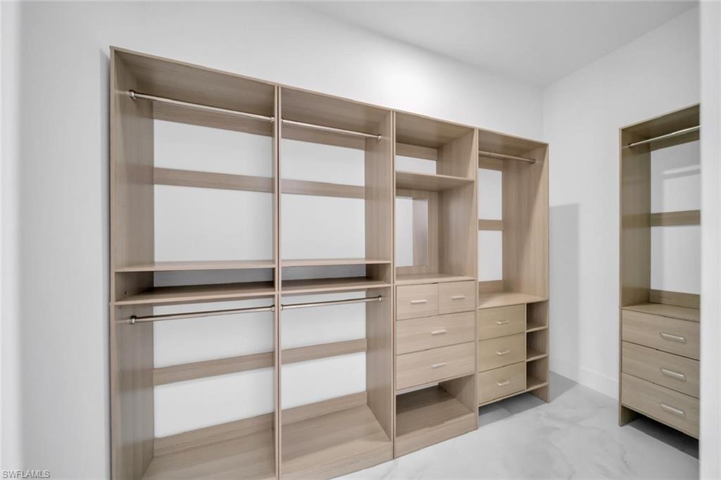 3312 17th Street Southwest Lehigh Acres, FL 33976 - Photo 10 of 12 a view of an empty room with cabinet and balcony