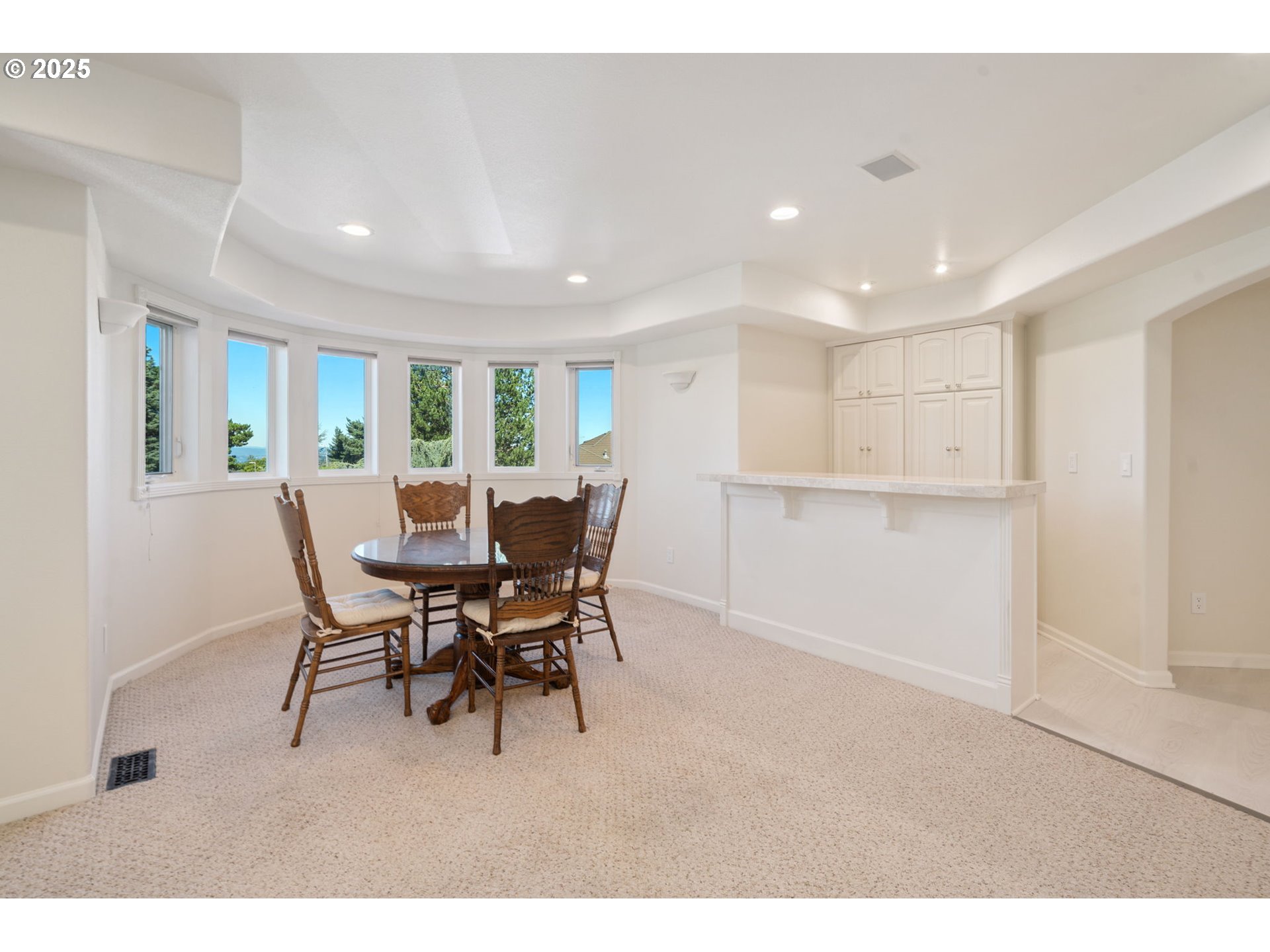 1650 Northwest Deerfern Street Camas, WA 98607 - Photo 18 of 47 a view of a dining room with furniture and a window
