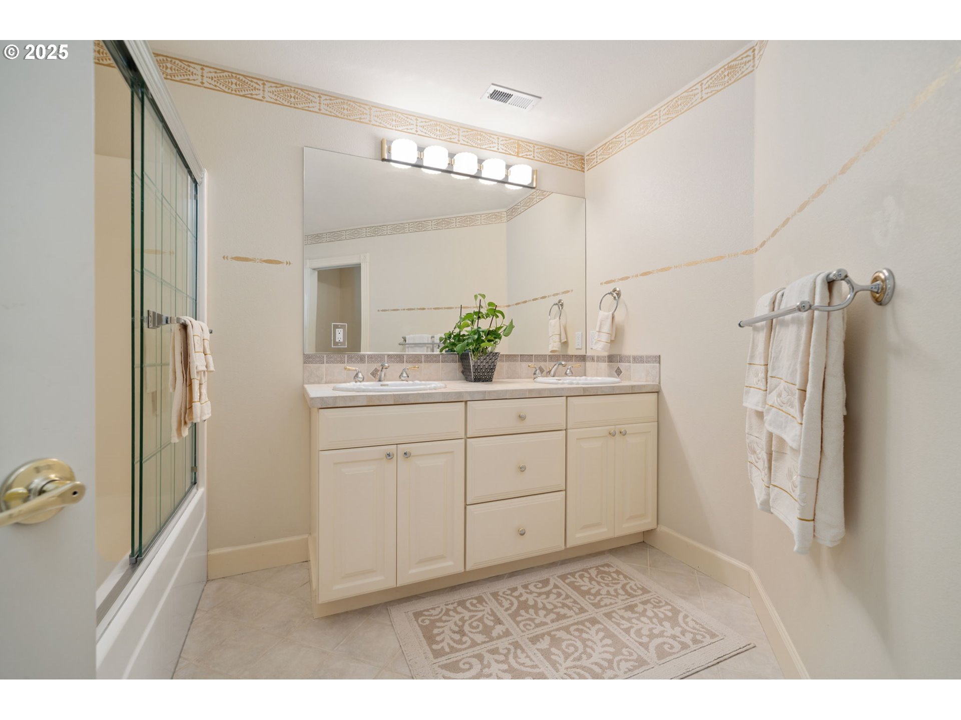 1650 Northwest Deerfern Street Camas, WA 98607 - Photo 25 of 47 a bathroom with a double vanity sink and mirror