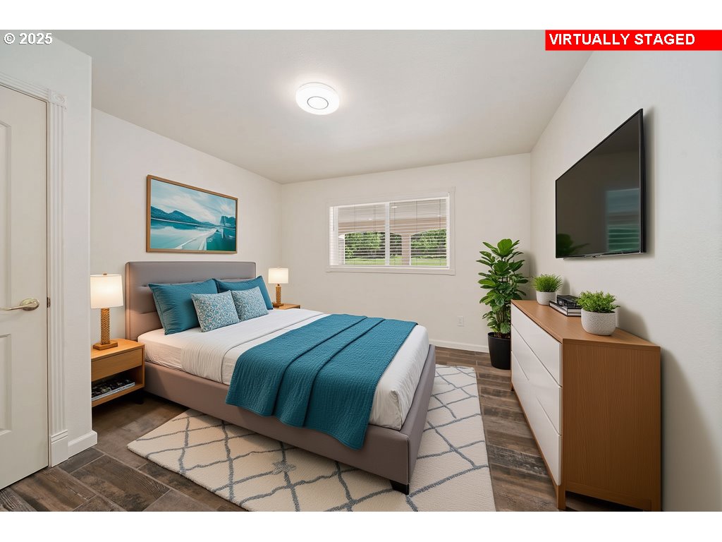 1650 Northwest Deerfern Street Camas, WA 98607 - Photo 45 of 47 a bedroom with a large bed and a flat screen tv
