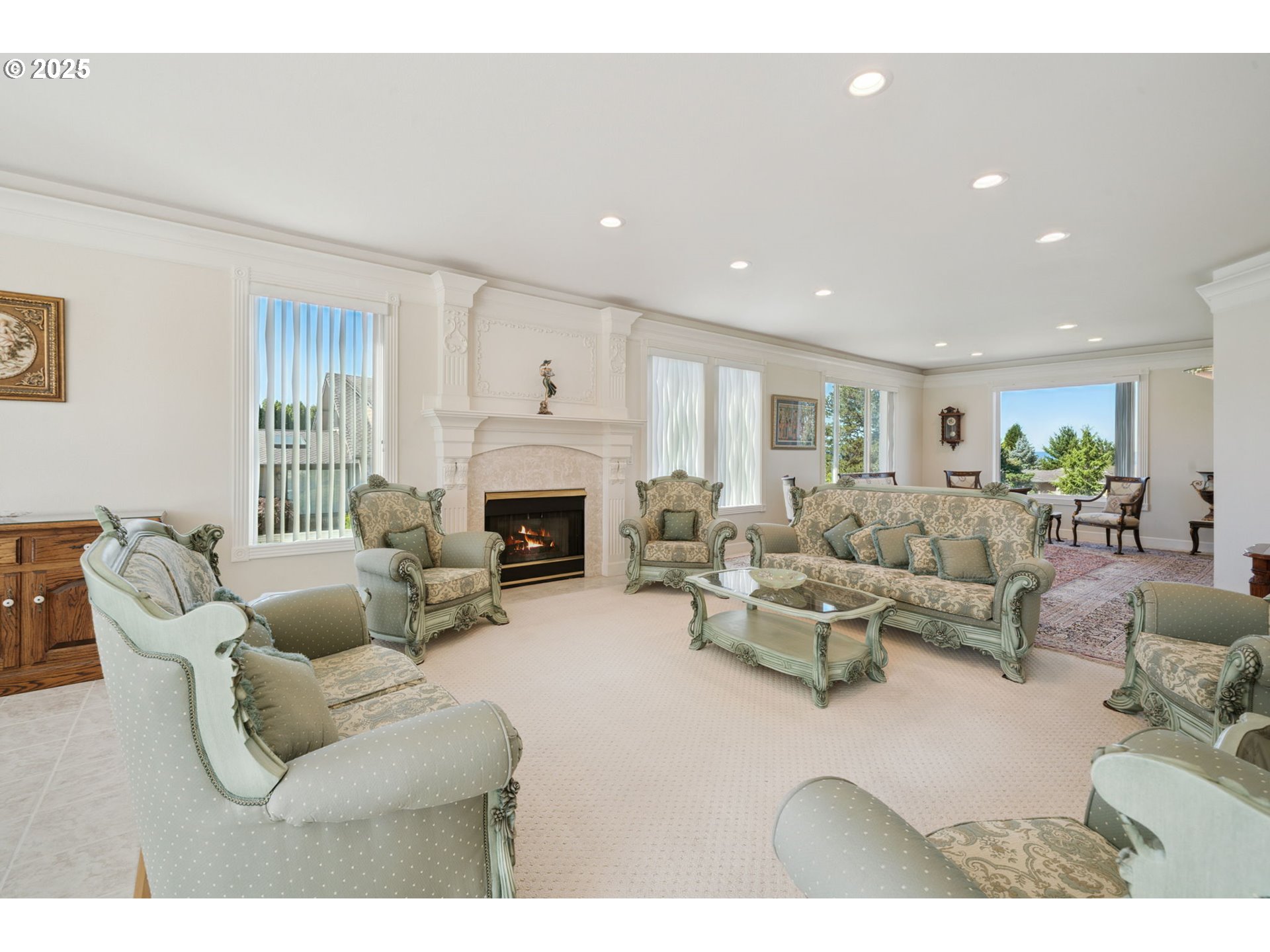 1650 Northwest Deerfern Street Camas, WA 98607 - Photo 10 of 47 a living room with furniture a fireplace and a flat screen tv