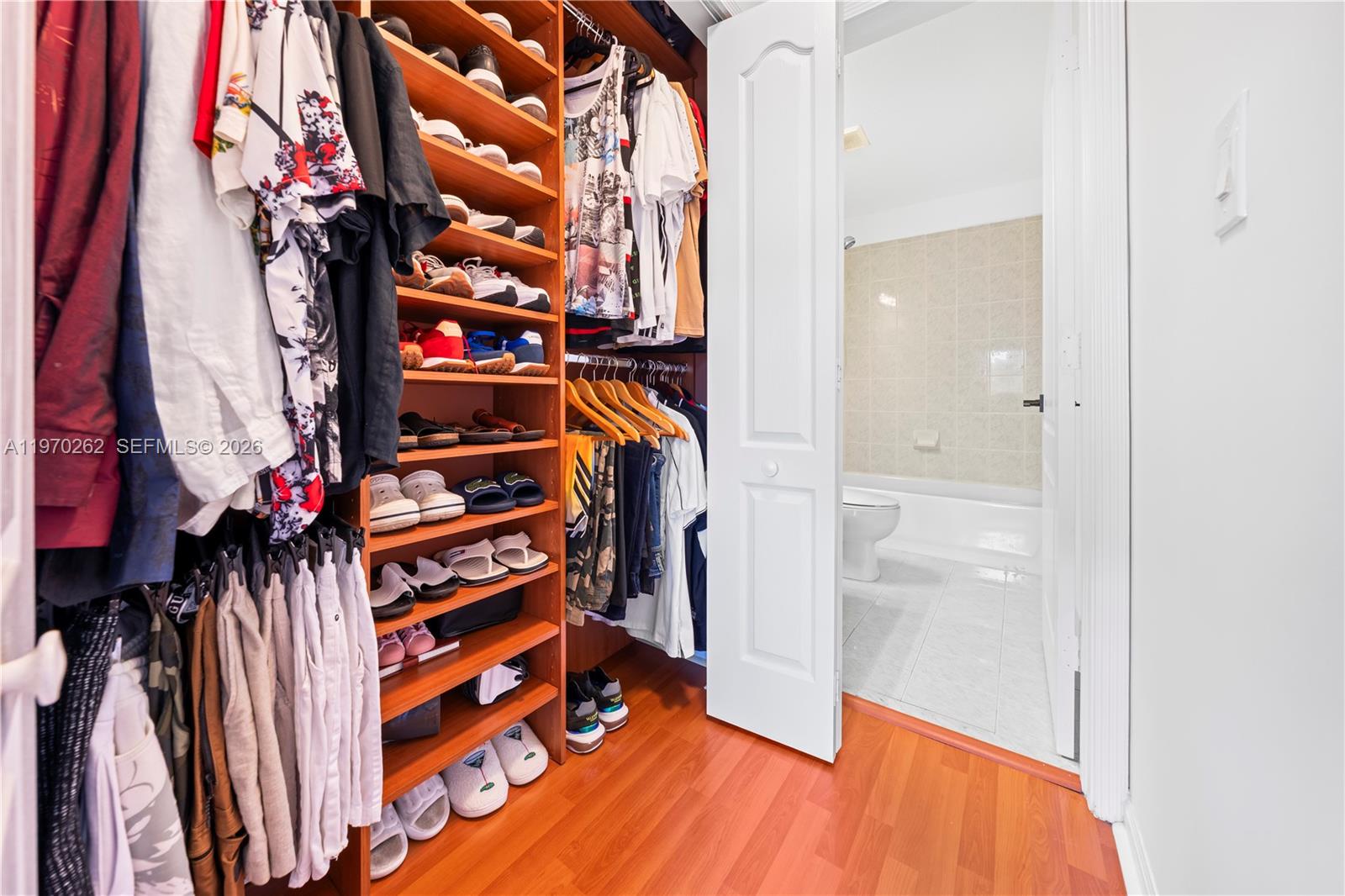 12858 Southwest 50th Street Miramar, FL 33027 - Photo 20 of 36 walk in closet with clothes and shoes