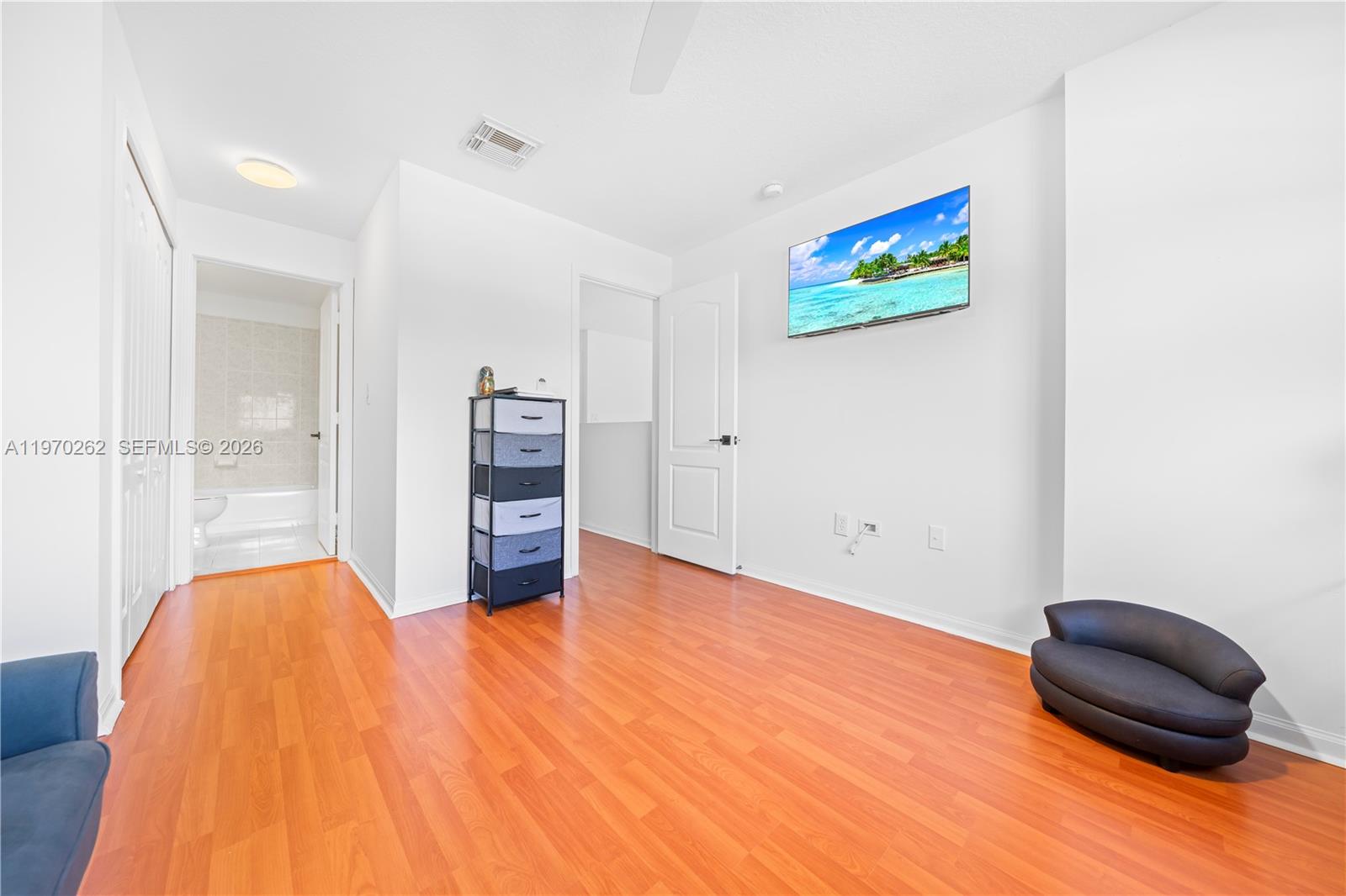 12858 Southwest 50th Street Miramar, FL 33027 - Photo 22 of 36 a view of a livingroom with furniture and cabinet