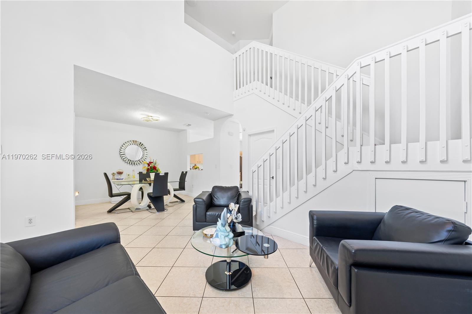 12858 Southwest 50th Street Miramar, FL 33027 - Photo 4 of 36 a living room with furniture and a potted plant