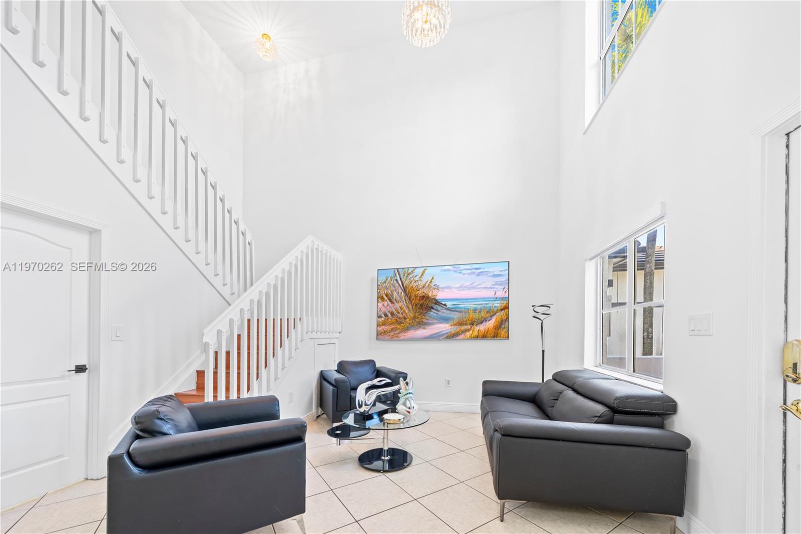 12858 Southwest 50th Street Miramar, FL 33027 - Photo 5 of 36 a living room with furniture and a couch