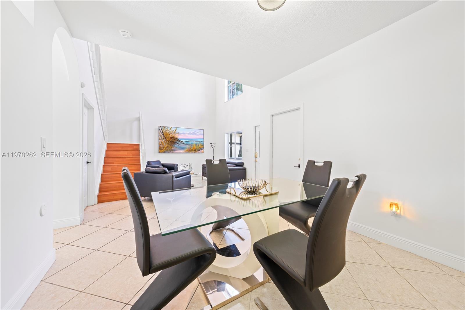 12858 Southwest 50th Street Miramar, FL 33027 - Photo 6 of 36 a dining room with furniture and wooden floor