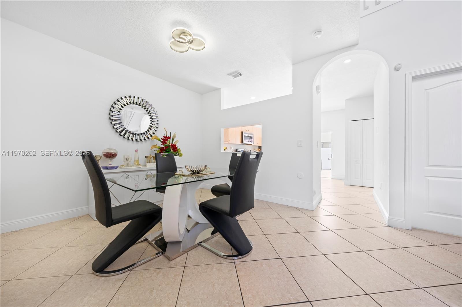 12858 Southwest 50th Street Miramar, FL 33027 - Photo 7 of 36 a view of a workspace with furniture and a window