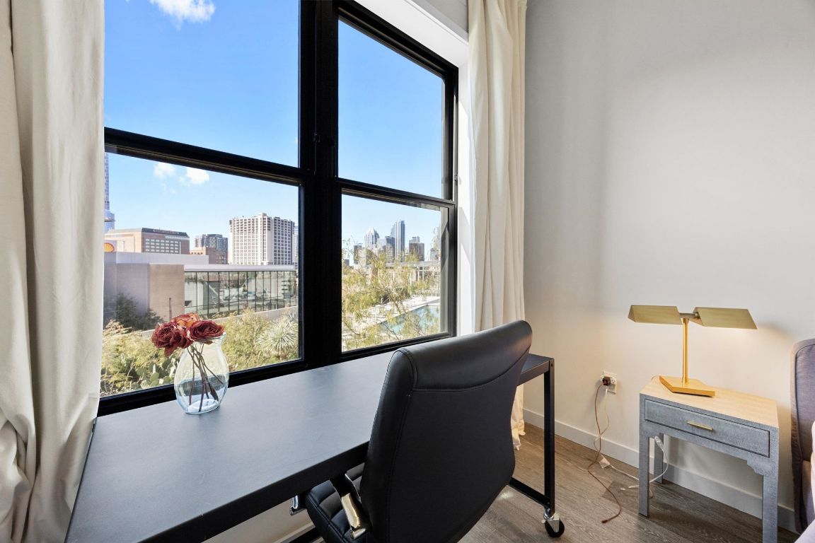 800 Embassy Drive, Unit 229 Austin, TX 78702 - Photo 25 of 40 a dining room with furniture and wooden floor