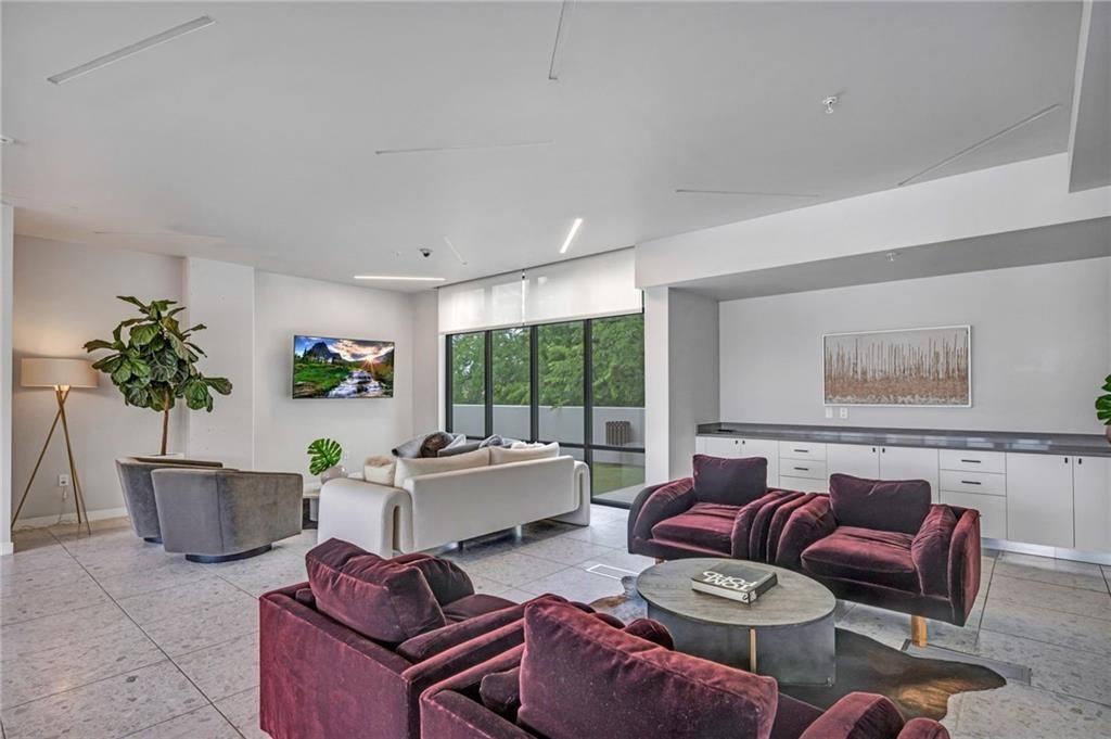 800 Embassy Drive, Unit 229 Austin, TX 78702 - Photo 35 of 40 a living room with furniture potted plant and windows