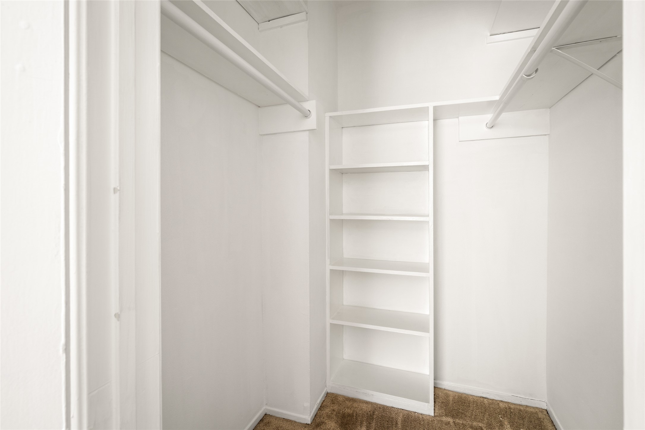 2238 South Piney Point Road, Unit 102 Houston, TX 77063 - Photo 12 of 20 a view of an empty walk in closet