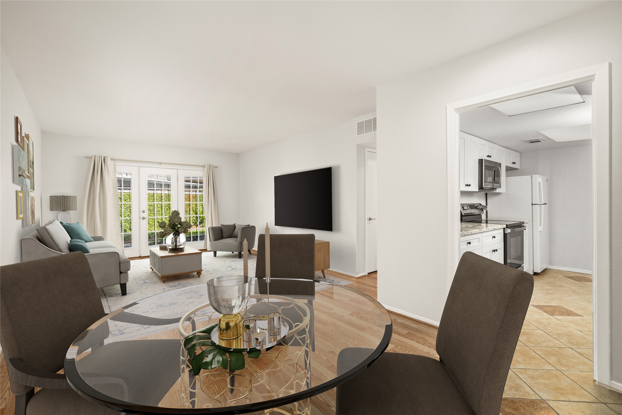 2238 South Piney Point Road, Unit 102 Houston, TX 77063 - Photo 13 of 20 a living room with furniture a flat screen tv and a large window