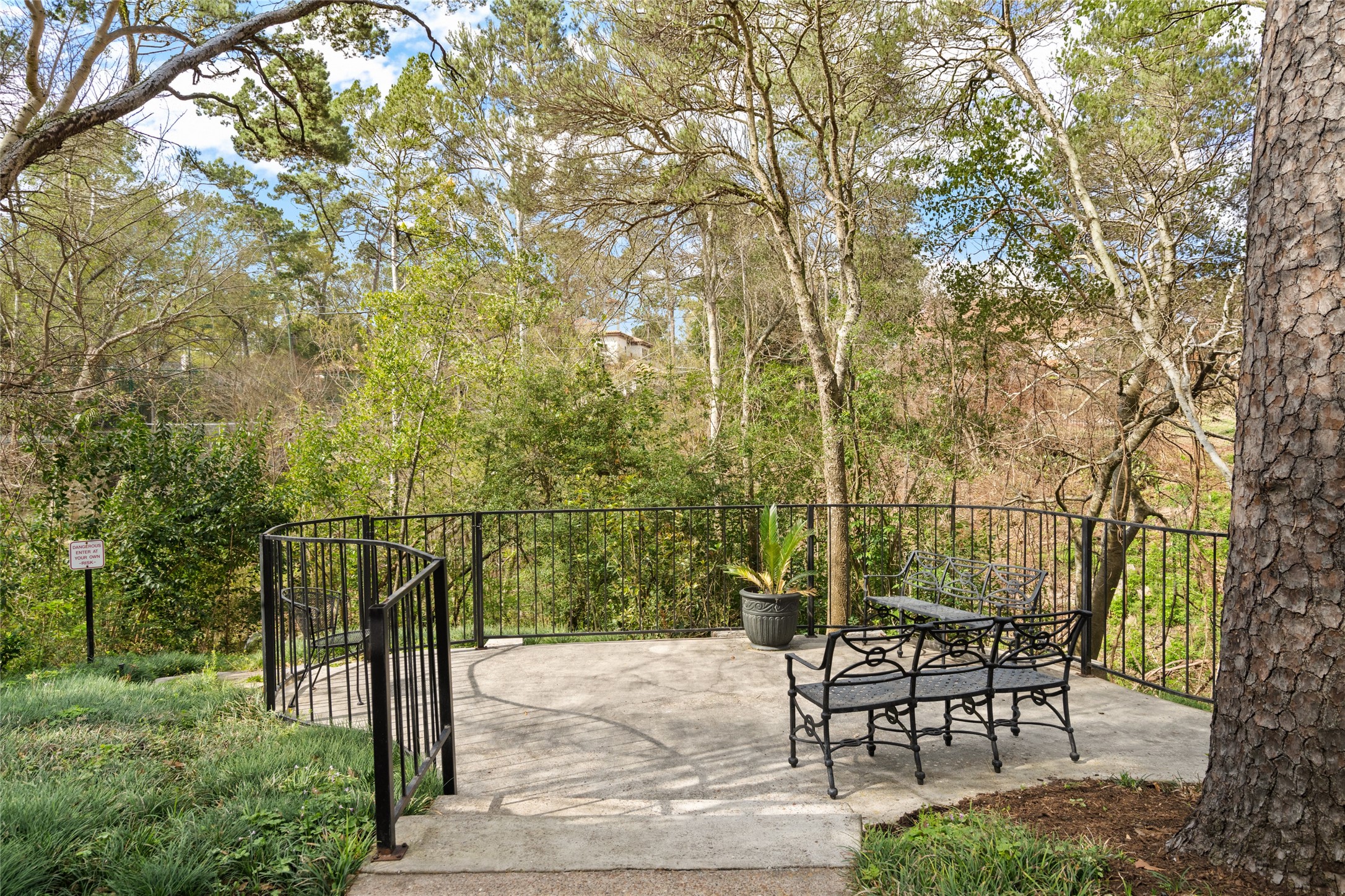 2238 South Piney Point Road, Unit 102 Houston, TX 77063 - Photo 16 of 20 a view of a bench in a backyard