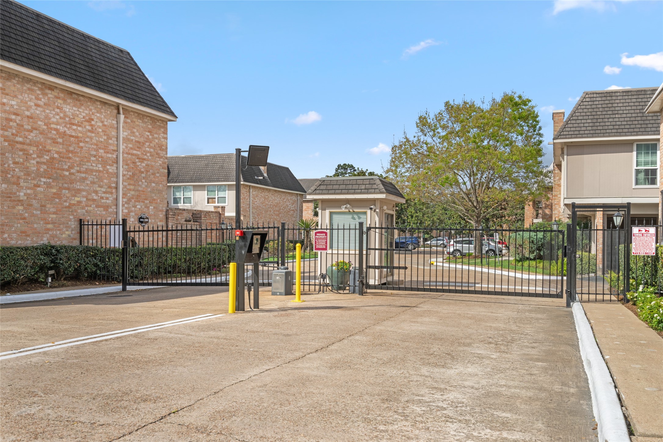 2238 South Piney Point Road, Unit 102 Houston, TX 77063 - Photo 17 of 20 a view of a brick house with a street