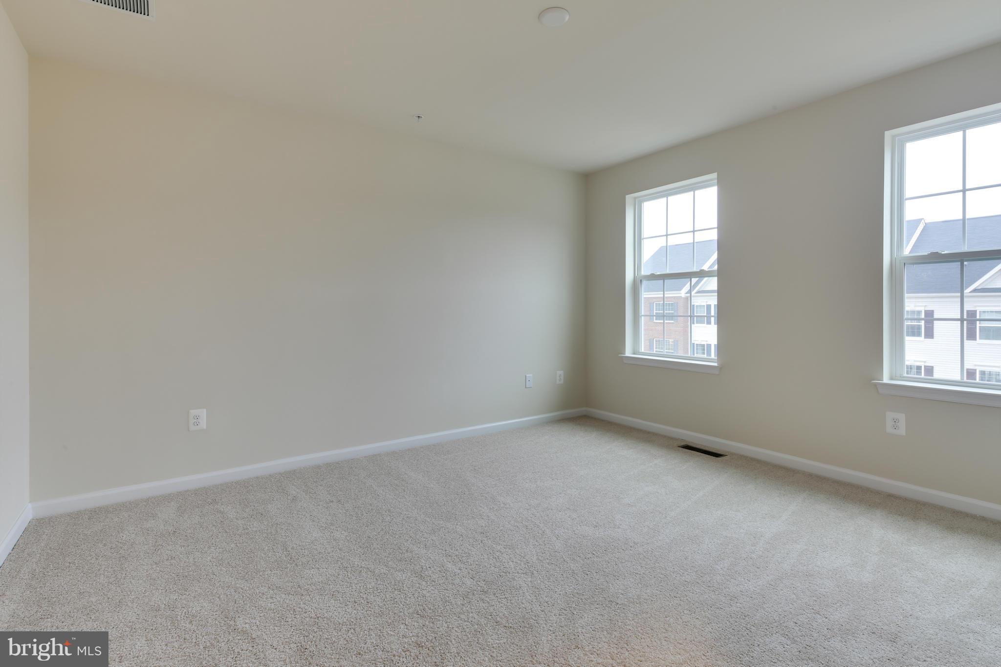 7240 Brinley Way Hanover, MD 21076 - Photo 17 of 22 an empty room with windows