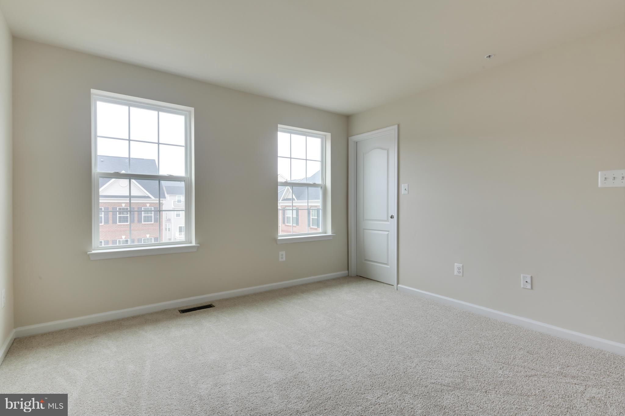 7240 Brinley Way Hanover, MD 21076 - Photo 18 of 22 a view of an empty room with a window
