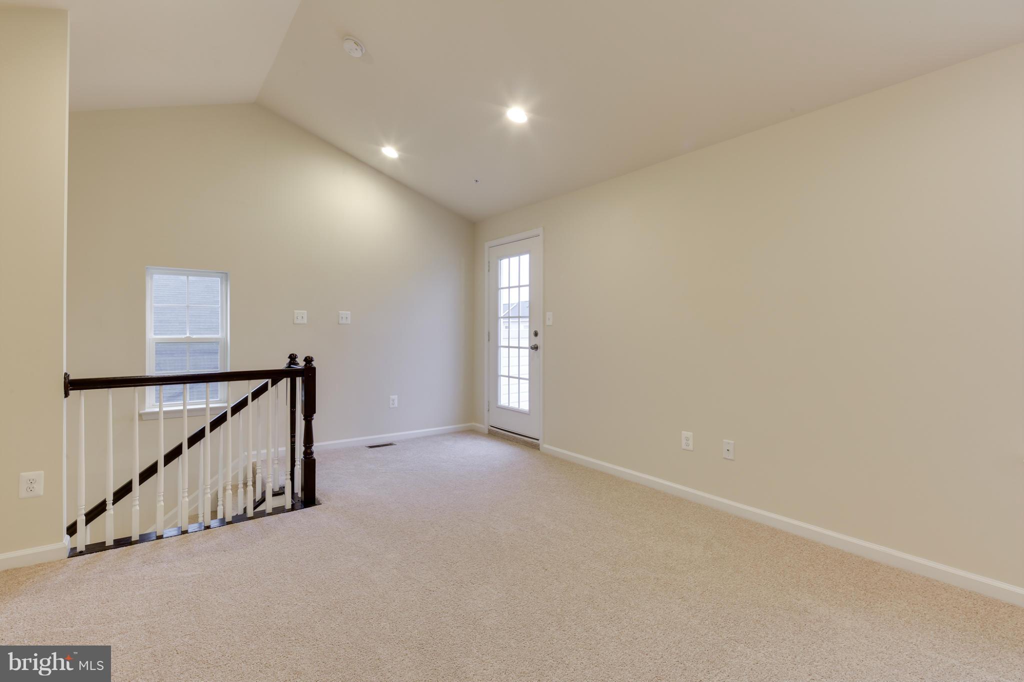 7240 Brinley Way Hanover, MD 21076 - Photo 21 of 22 a view of an empty room with stairs