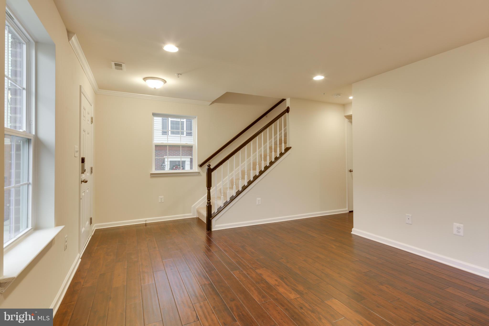 7240 Brinley Way Hanover, MD 21076 - Photo 4 of 22 a view of entryway with wooden floor