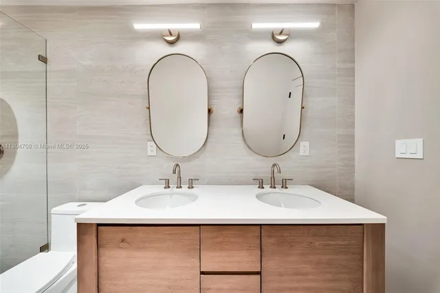 a bathroom with a toilet and shower