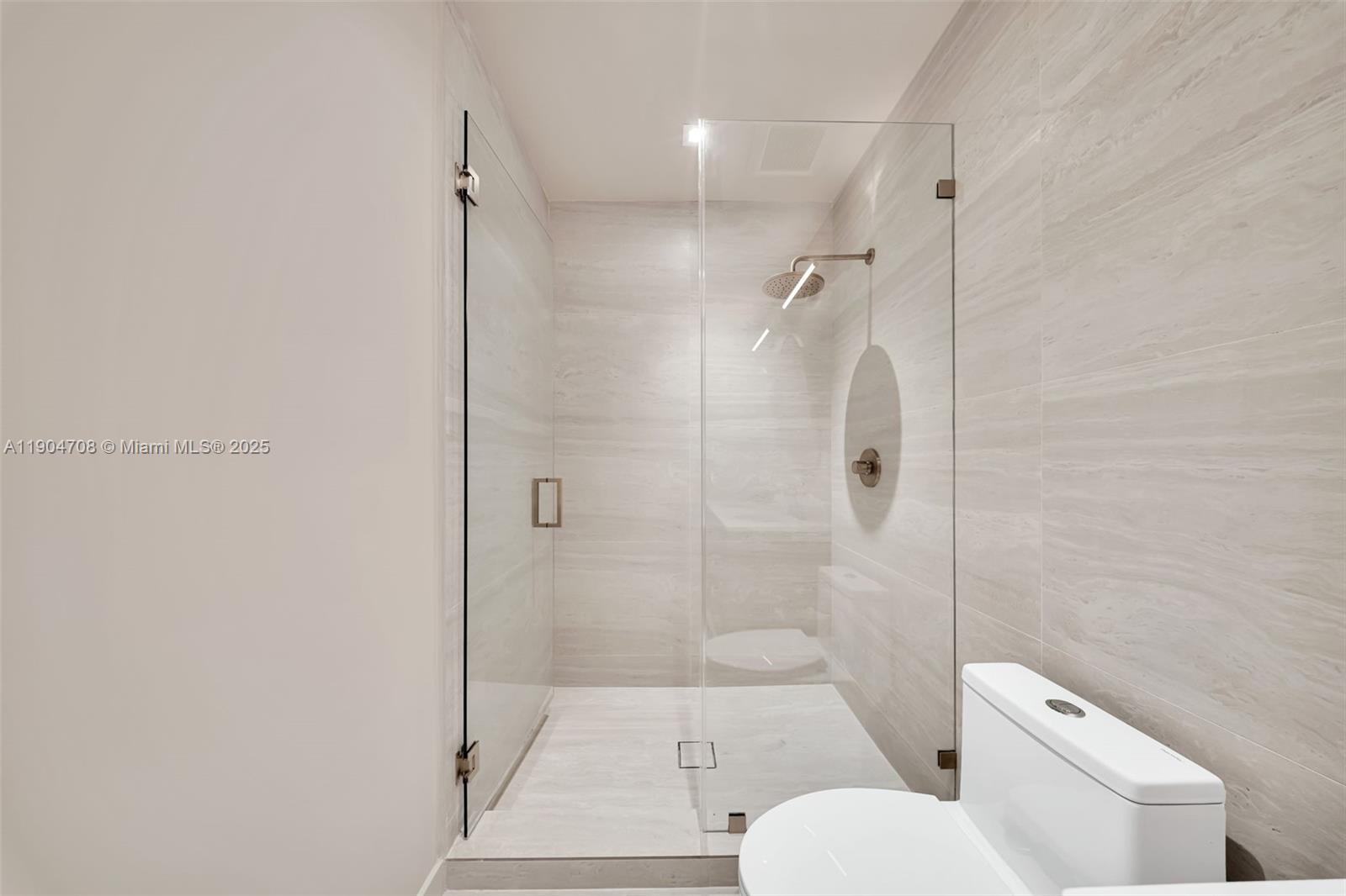 2625 Southwest 32nd Court Miami, FL 33133 - Photo 13 of 23 a bathroom with a toilet and shower