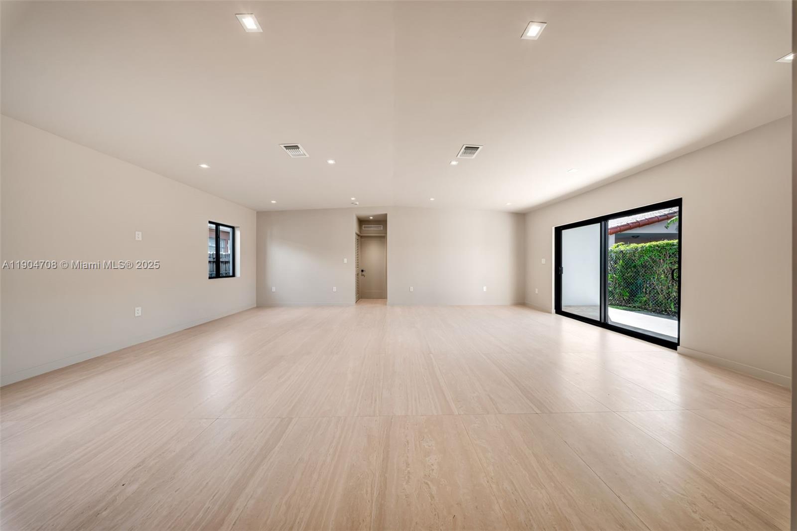 2625 Southwest 32nd Court Miami, FL 33133 - Photo 14 of 23 a view of an empty room with wooden floor and a window