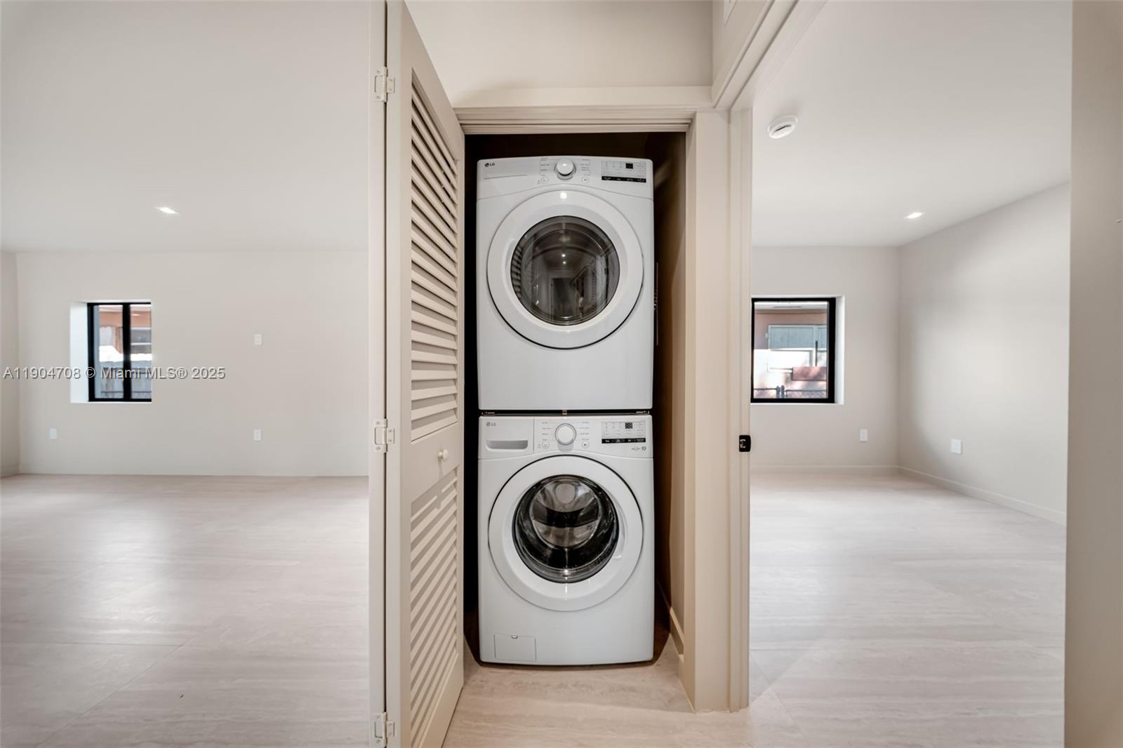 2625 Southwest 32nd Court Miami, FL 33133 - Photo 16 of 23 a utility room with dryer and washer