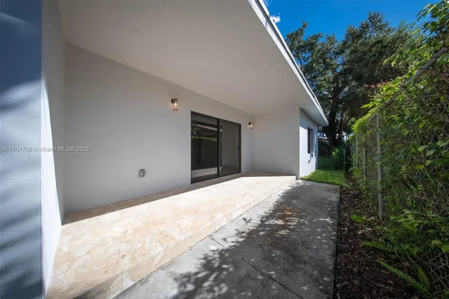 a view of a backyard of the house