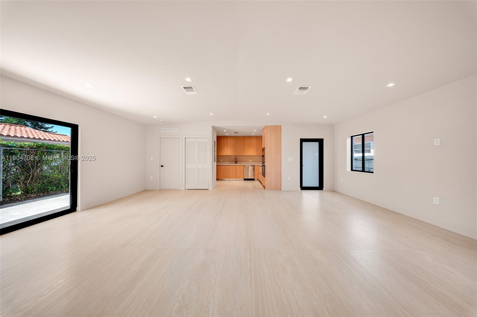 2625 Southwest 32nd Court Miami, FL 33133 - Photo 6 of 23 a view of an empty room with a window and fireplace