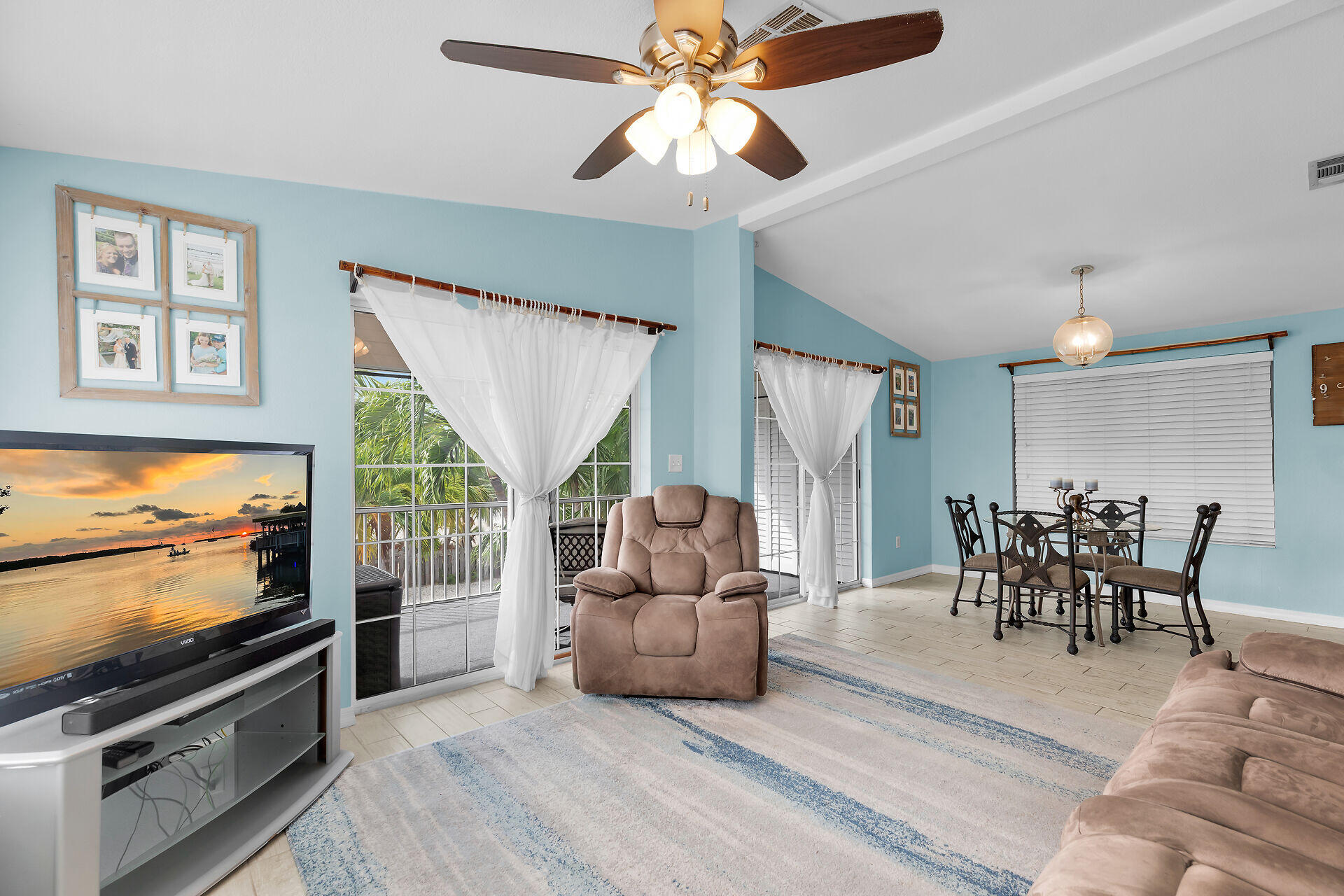23012 Snapper Lane Cudjoe, FL 33042 - Photo 14 of 45 a living room with furniture and a flat screen tv