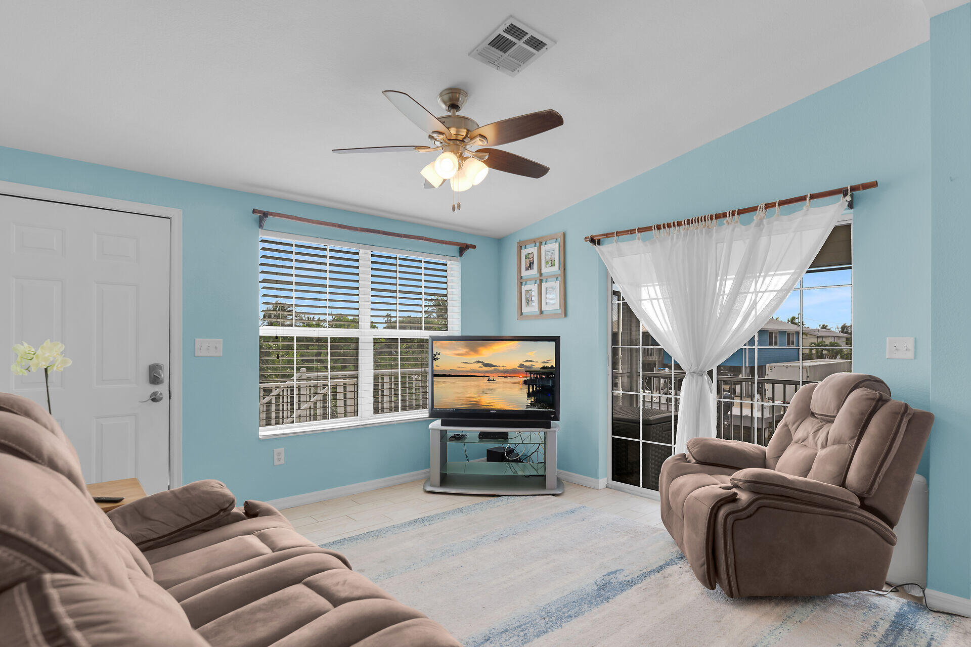 23012 Snapper Lane Cudjoe, FL 33042 - Photo 15 of 45 a living room with furniture a ceiling fan and a window