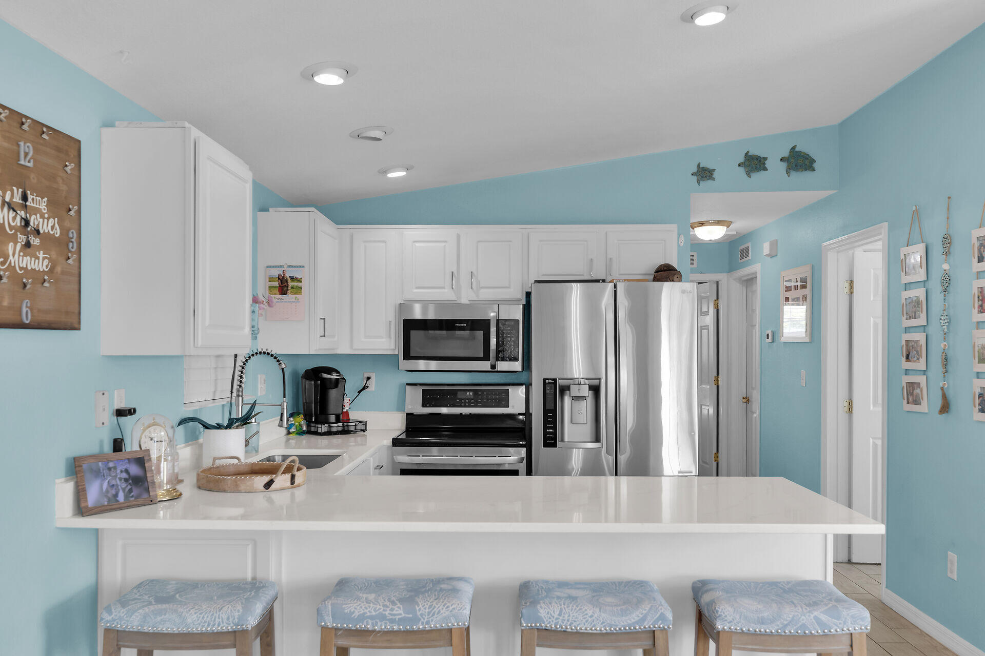 23012 Snapper Lane Cudjoe, FL 33042 - Photo 18 of 45 a kitchen with stainless steel appliances a refrigerator and a stove top oven