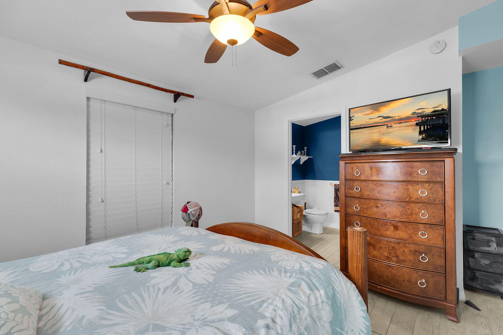 23012 Snapper Lane Cudjoe, FL 33042 - Photo 24 of 45 a bedroom with a bed and a chandelier