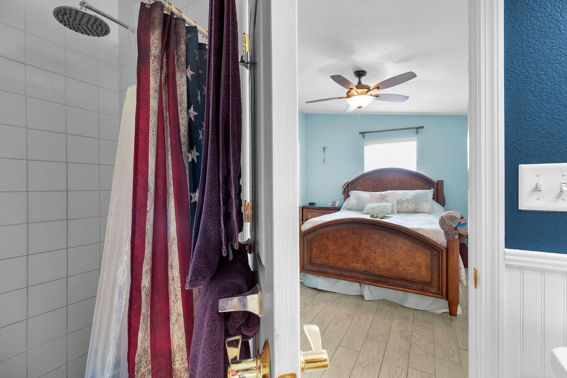 23012 Snapper Lane Cudjoe, FL 33042 - Photo 27 of 45 a bedroom with a bed and a chandelier