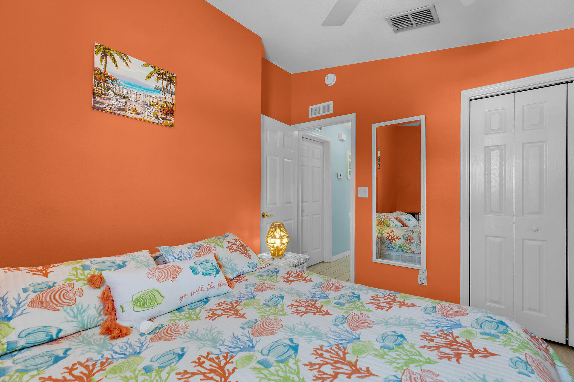 23012 Snapper Lane Cudjoe, FL 33042 - Photo 30 of 45 a bedroom with a bed and a painting on the wall