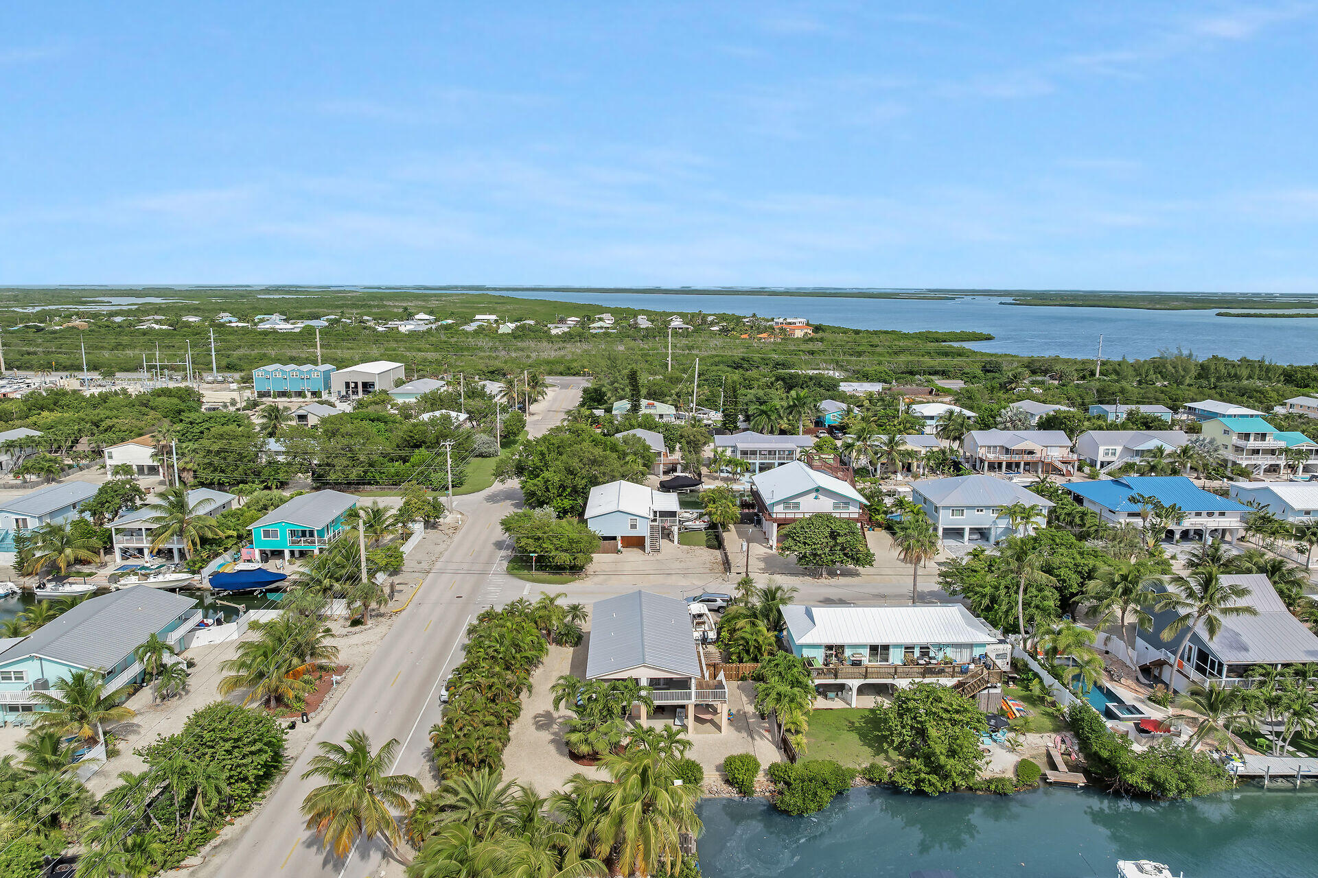23012 Snapper Lane Cudjoe, FL 33042 - Photo 3 of 45 an aerial view of residential houses with outdoor space and trees