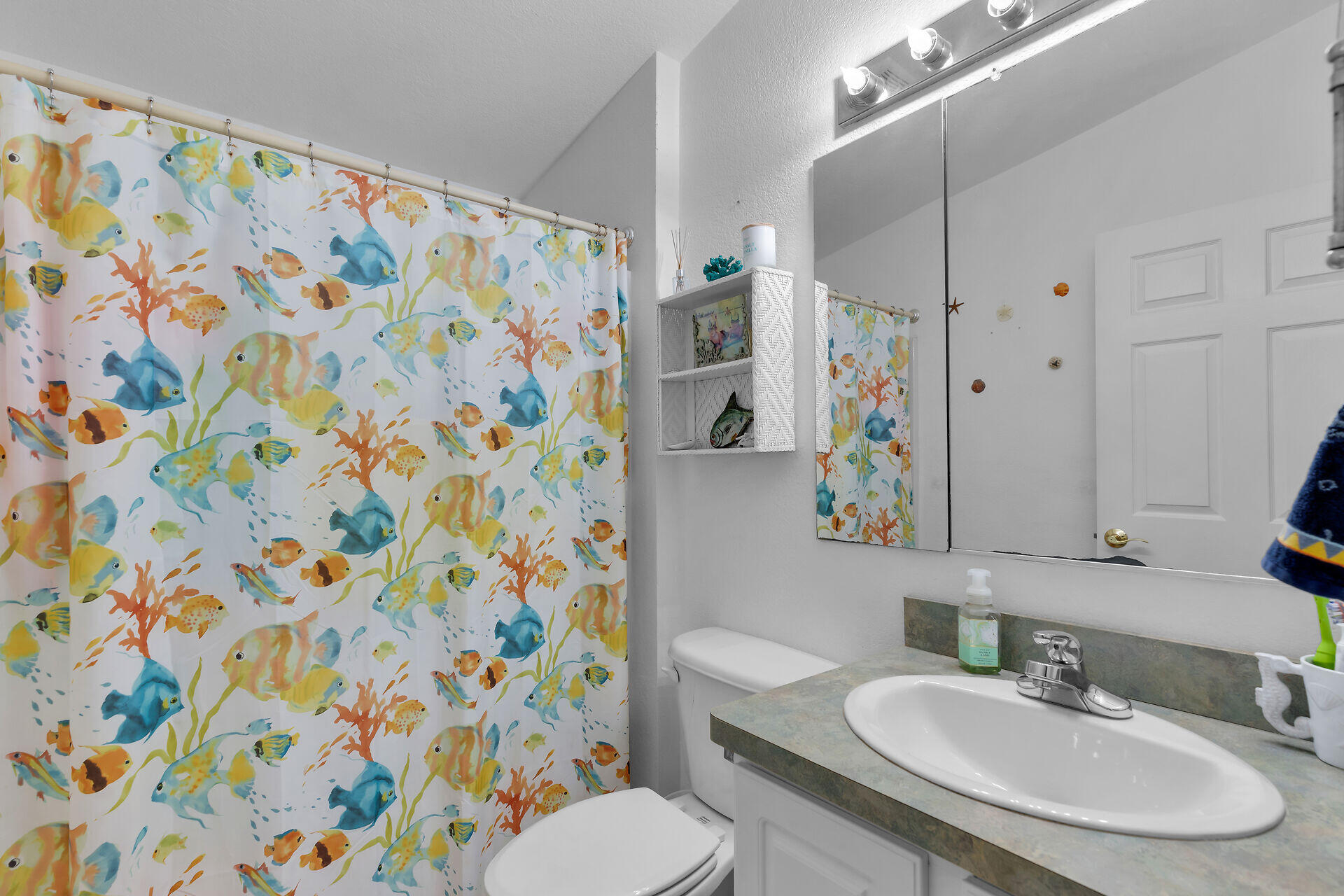 23012 Snapper Lane Cudjoe, FL 33042 - Photo 31 of 45 a bathroom with a sink toilet and shower