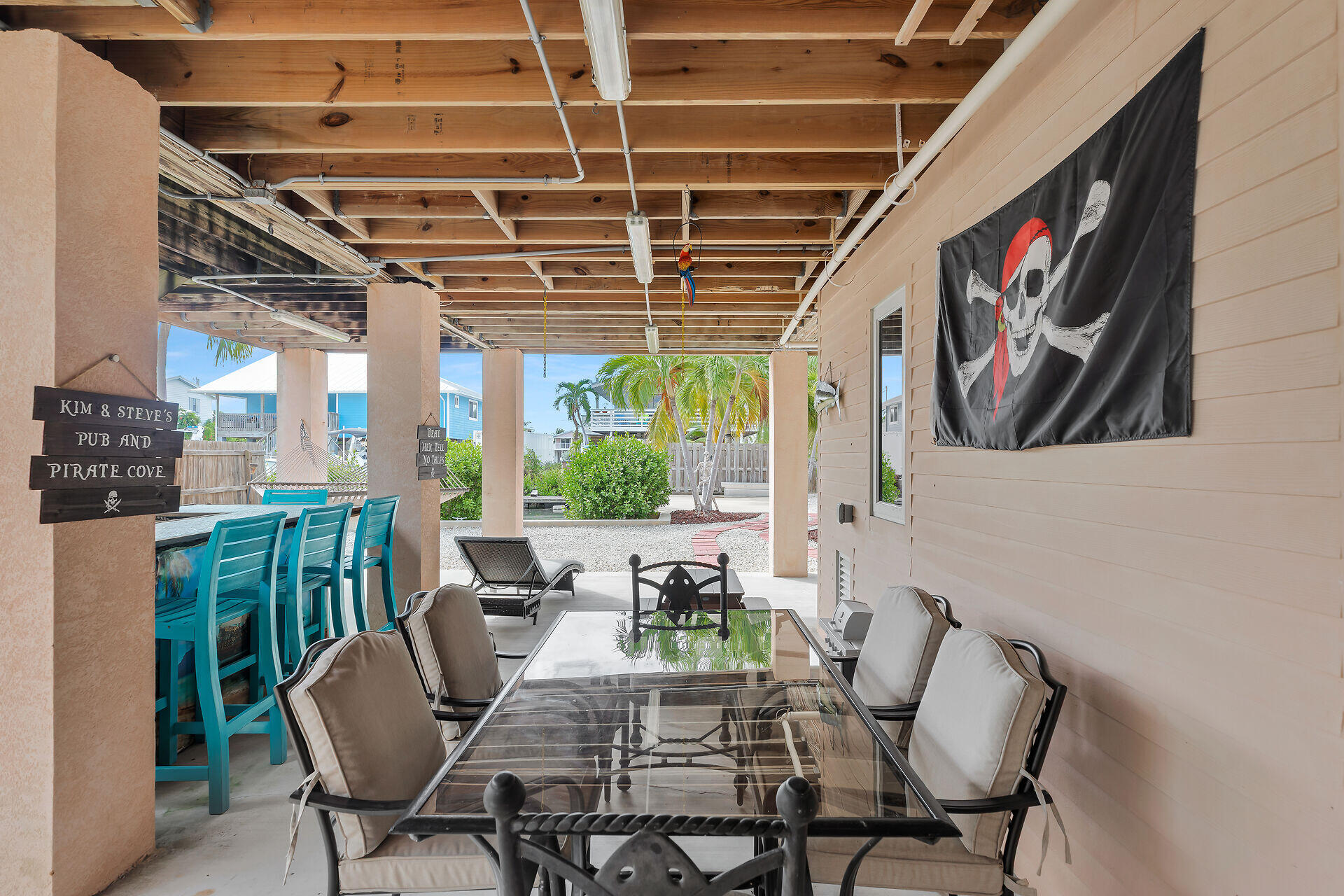 23012 Snapper Lane Cudjoe, FL 33042 - Photo 35 of 45 a view of a porch with furniture and a potted plant