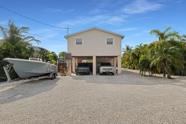 a view of car parked in front of house