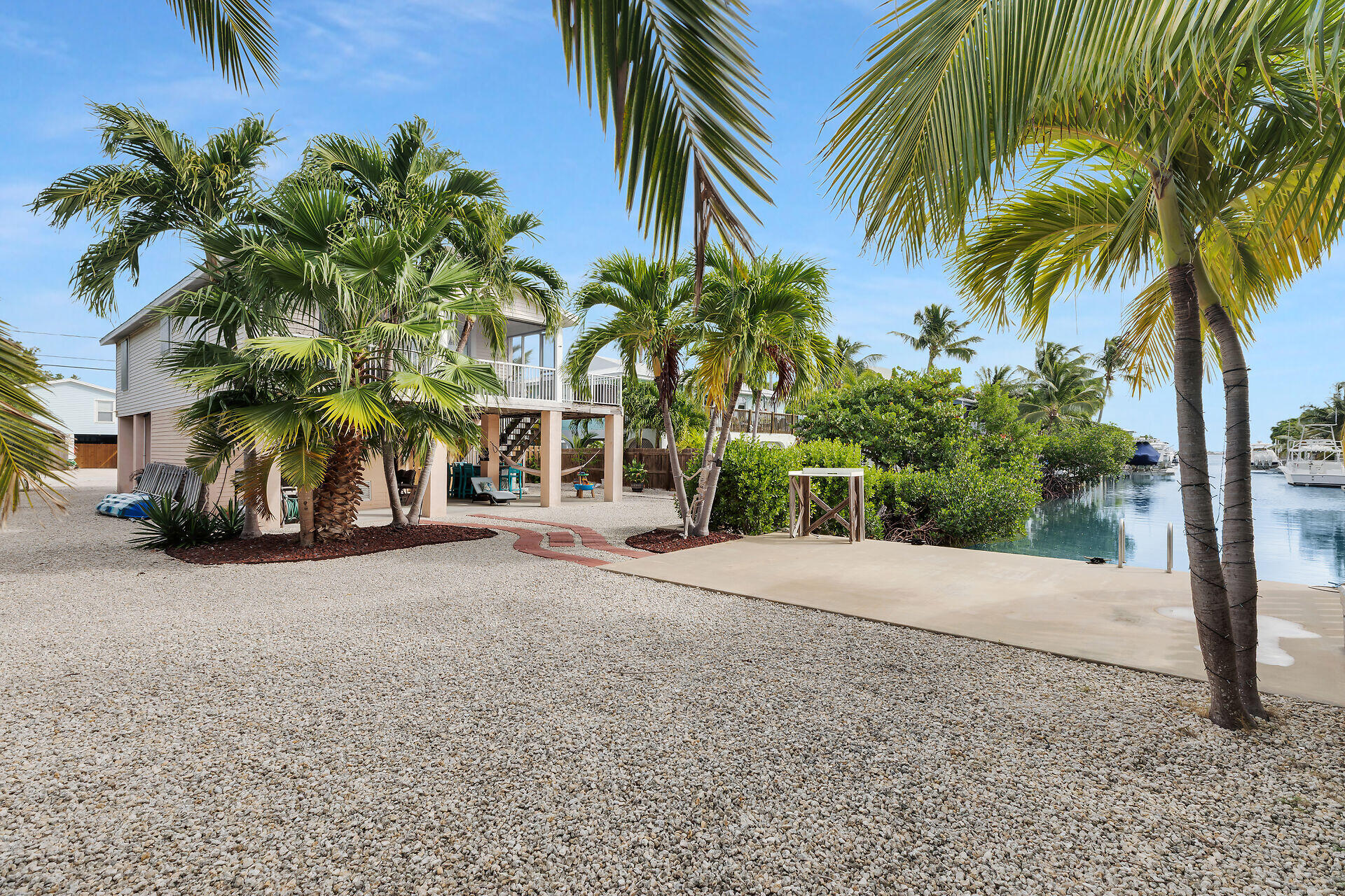 23012 Snapper Lane Cudjoe, FL 33042 - Photo 42 of 45 a view of a street with a palm trees
