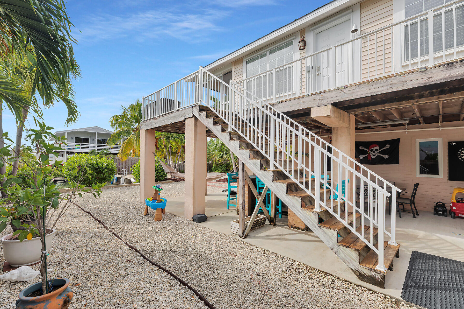 23012 Snapper Lane Cudjoe, FL 33042 - Photo 9 of 45 a view of a house with wooden stairs