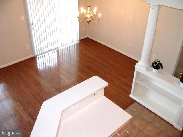 a view of a living room with a fireplace